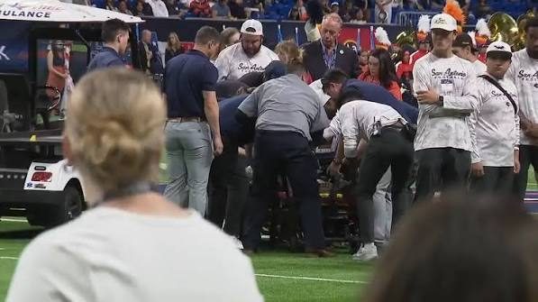 Emergency medical responders attending to the injured airman after the UTSA game accident